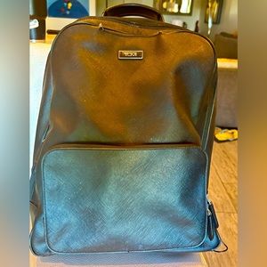 TUMI leather backpack.